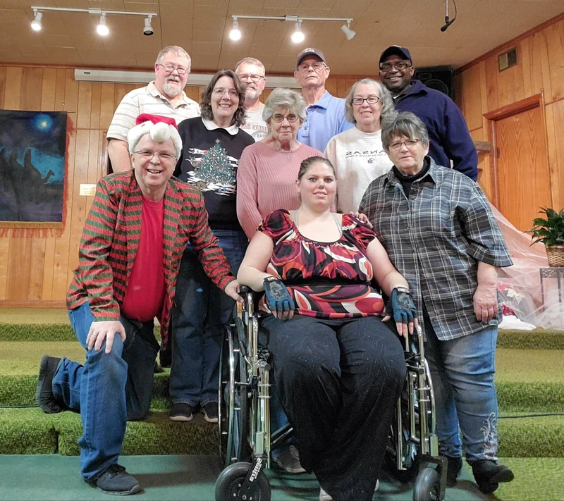 A group gathered for a seasonal photograph inside Park Avenue’s wood-paneled sanctuary.
